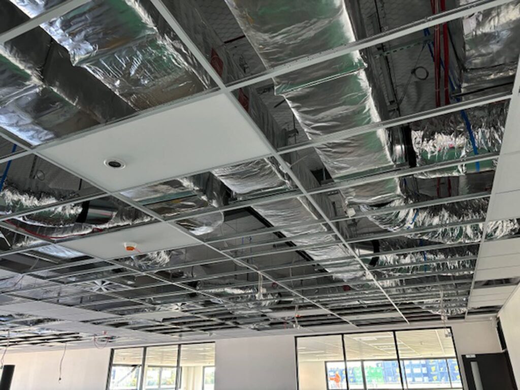 Ceiling-mounted commercial HVAC and ventilation systems installed by Beattie Air at Waterloo Business Park, Halswell, Christchurch, featuring energy-efficient air conditioning and heating systems